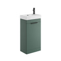 Green vanity unit with white sink and black faucet on a white background