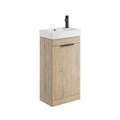Bathroom vanity with wooden cabinet and white sink on a white background
