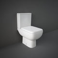 White toilet against a dark gray wall